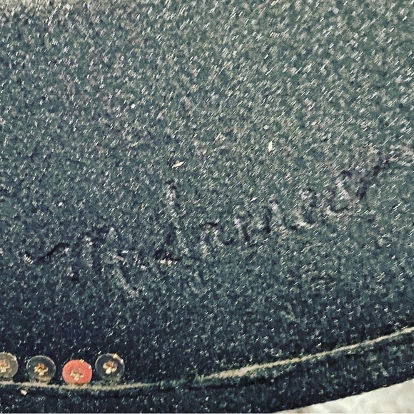 This was a plain felt fedora. The studs are metal and screwed in individually. - Picture 3 of 5